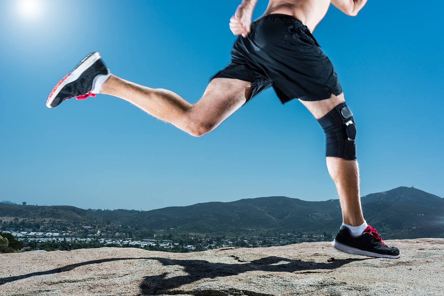 Person running with a knee brace